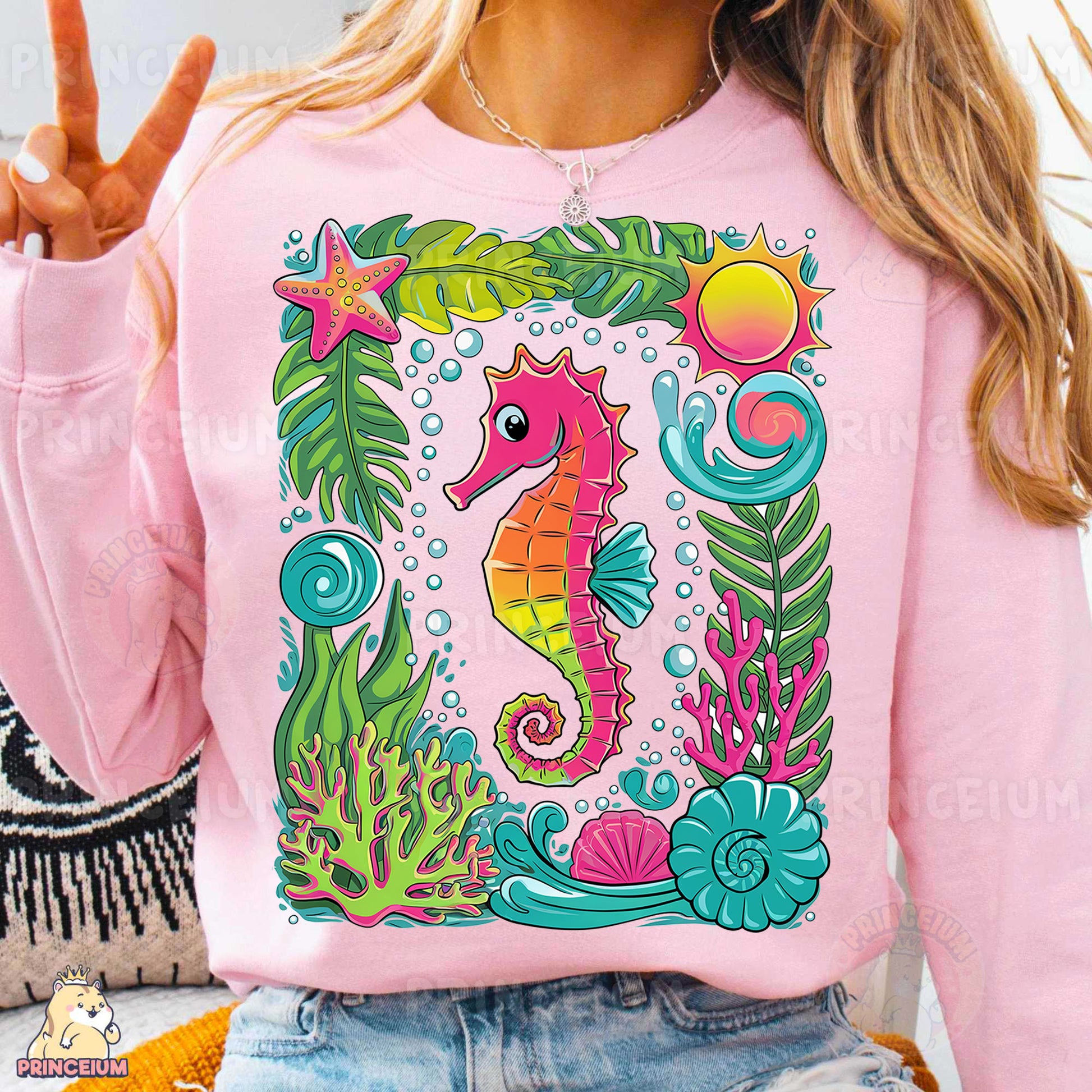 a woman wearing a pink shirt with a sea horse on it