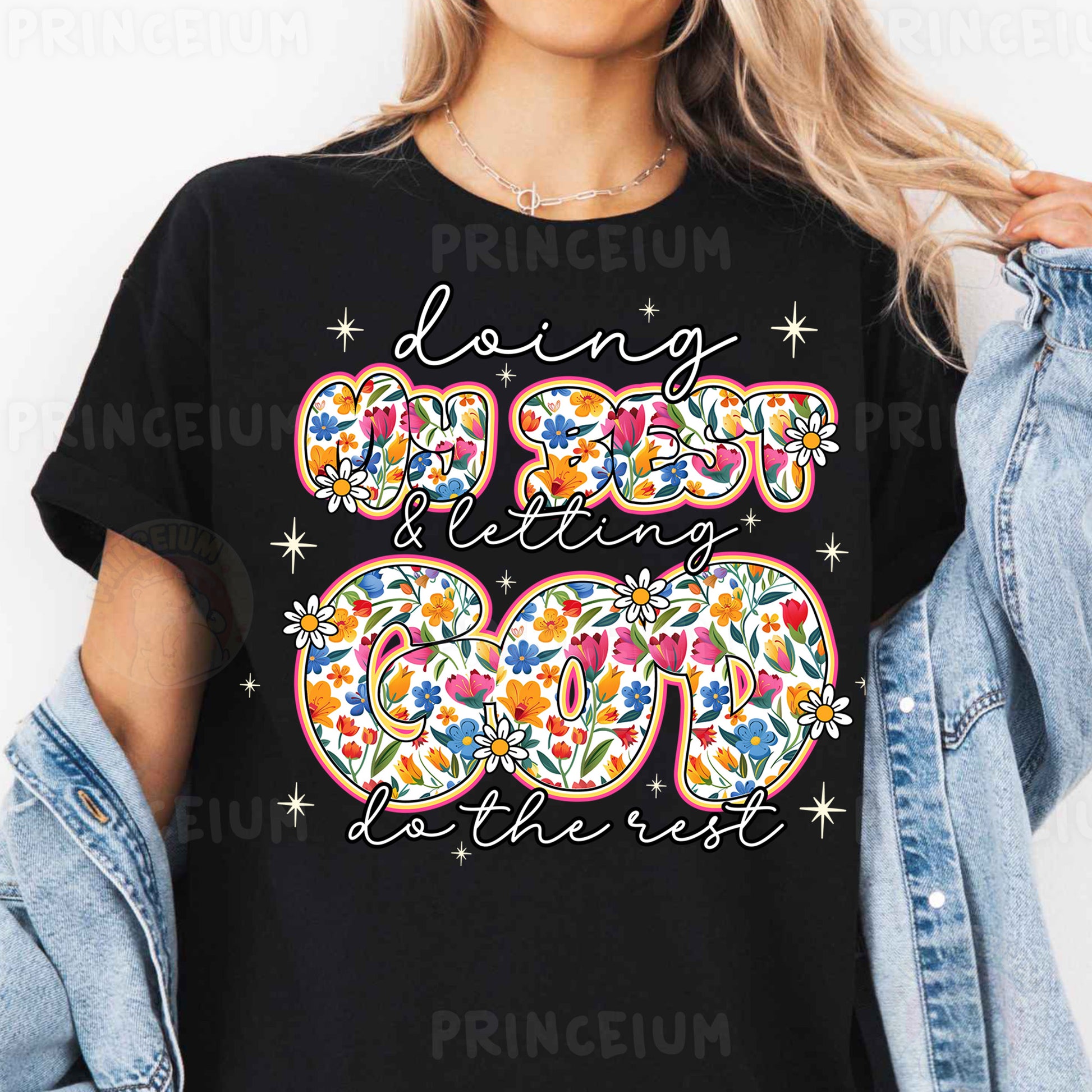 a woman wearing a black t - shirt with a floral design