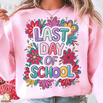 a woman wearing a pink sweatshirt that says last day of school