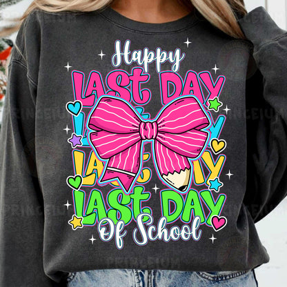 a woman wearing a black sweatshirt with a pink bow