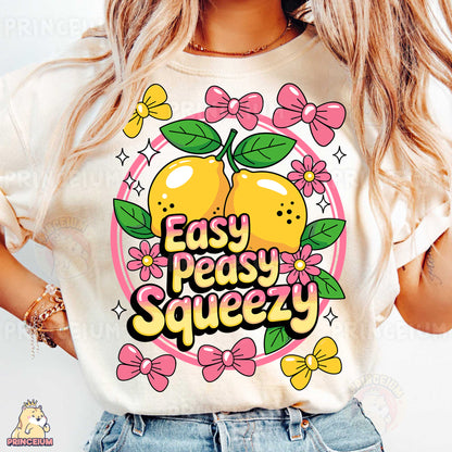 a woman wearing a t - shirt that says easy peasy squeezey