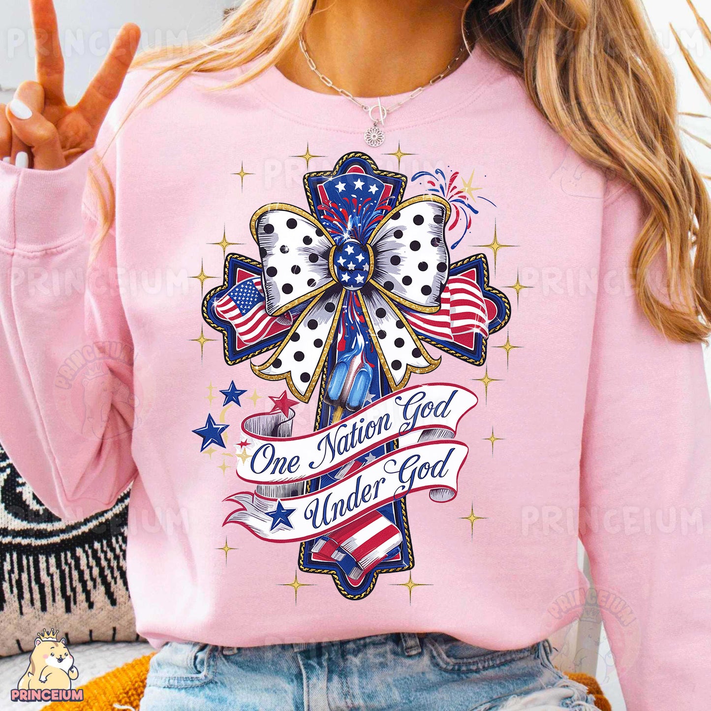 a woman wearing a pink shirt with a cross on it