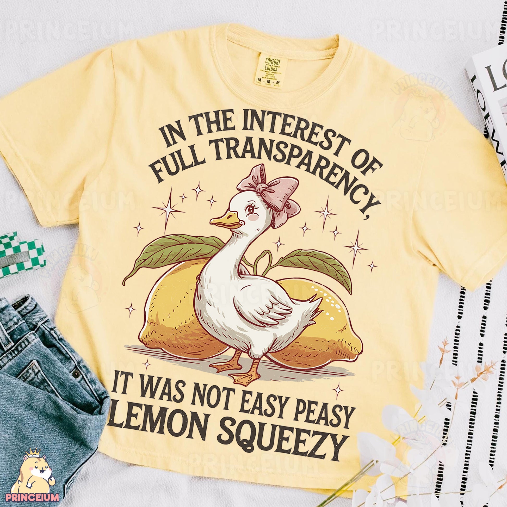 a yellow t - shirt with a picture of a duck on it