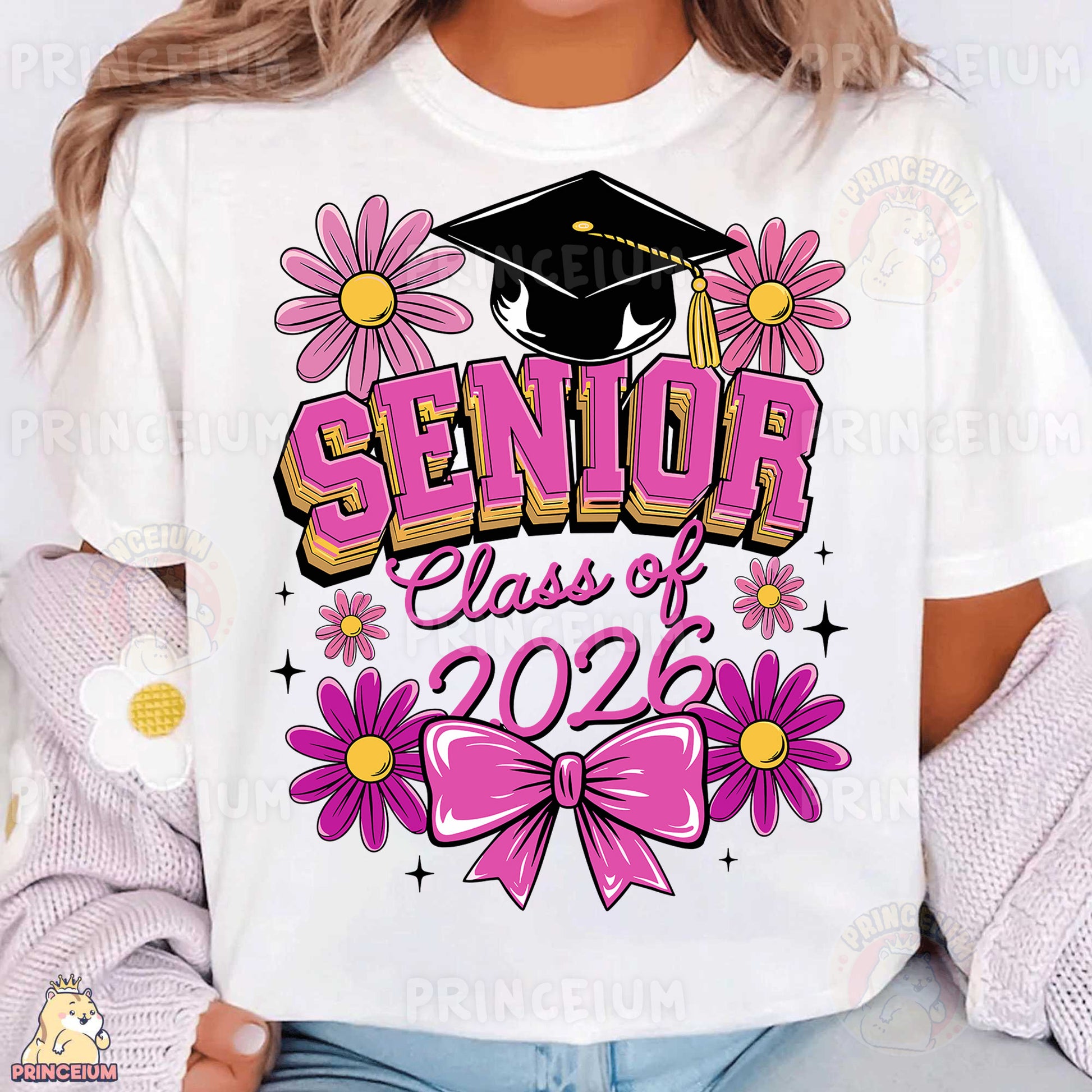a woman wearing a white shirt with pink flowers and a graduation cap