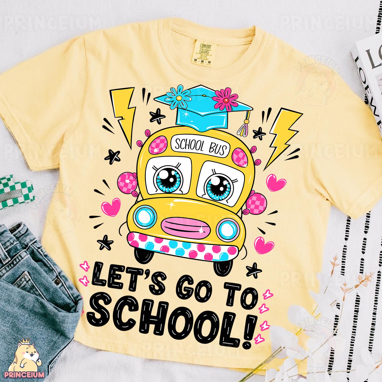 a yellow shirt with a school bus on it