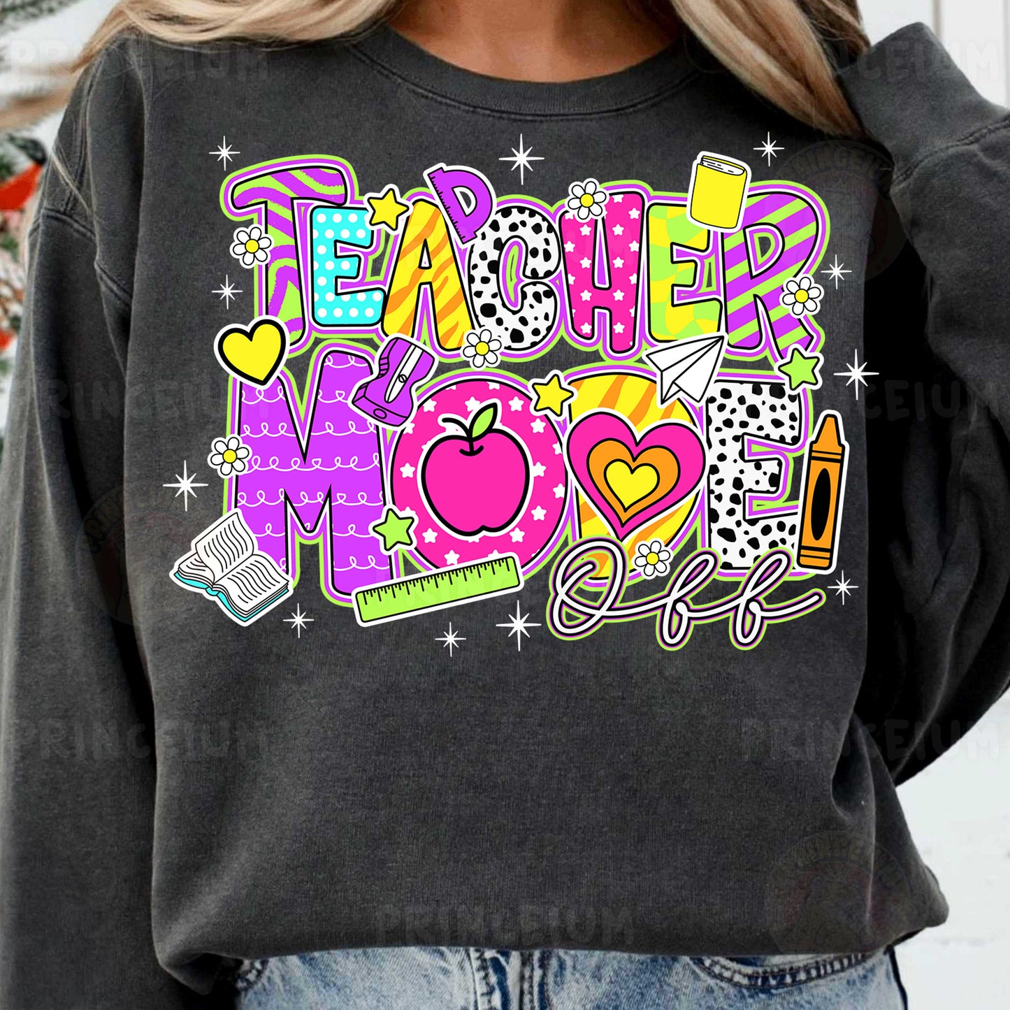 a woman wearing a teacher mom sweatshirt