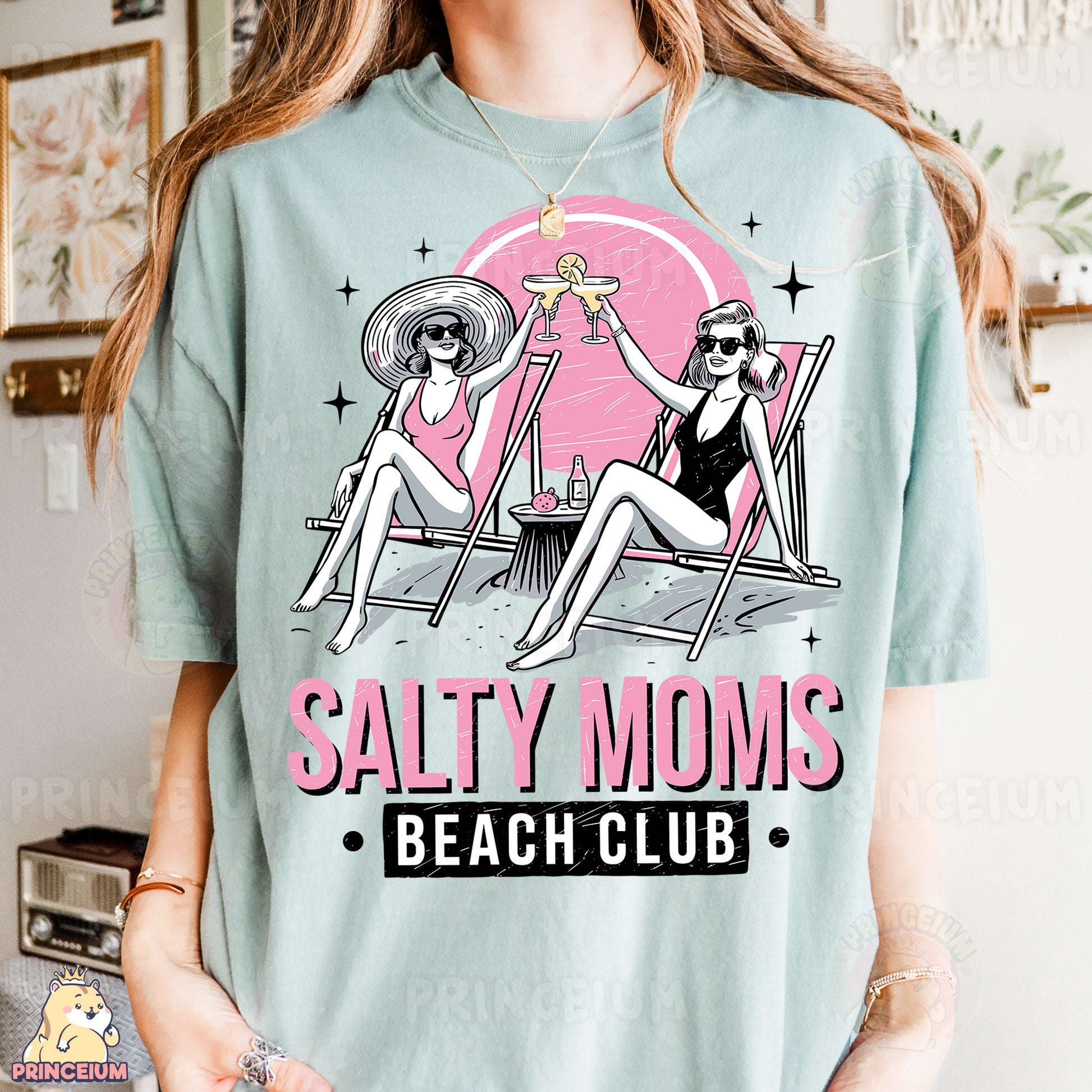 a woman wearing a t - shirt that says salty moms beach club