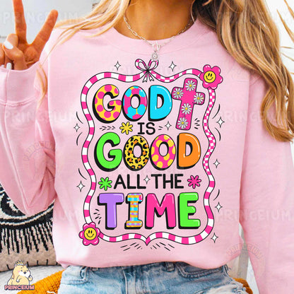 a woman wearing a pink shirt that says god is good all the time