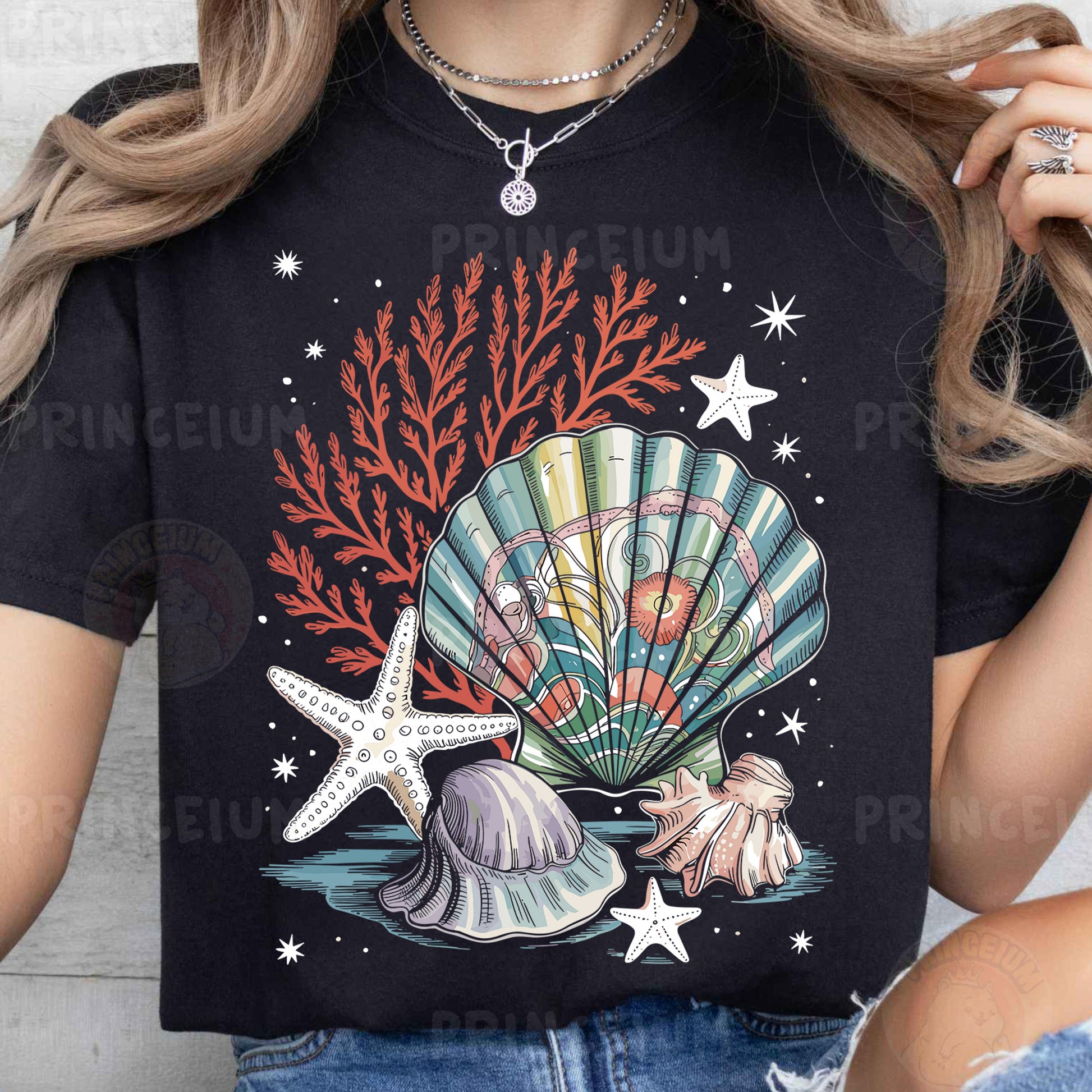 a woman wearing a t - shirt with a seashell and starfish on it