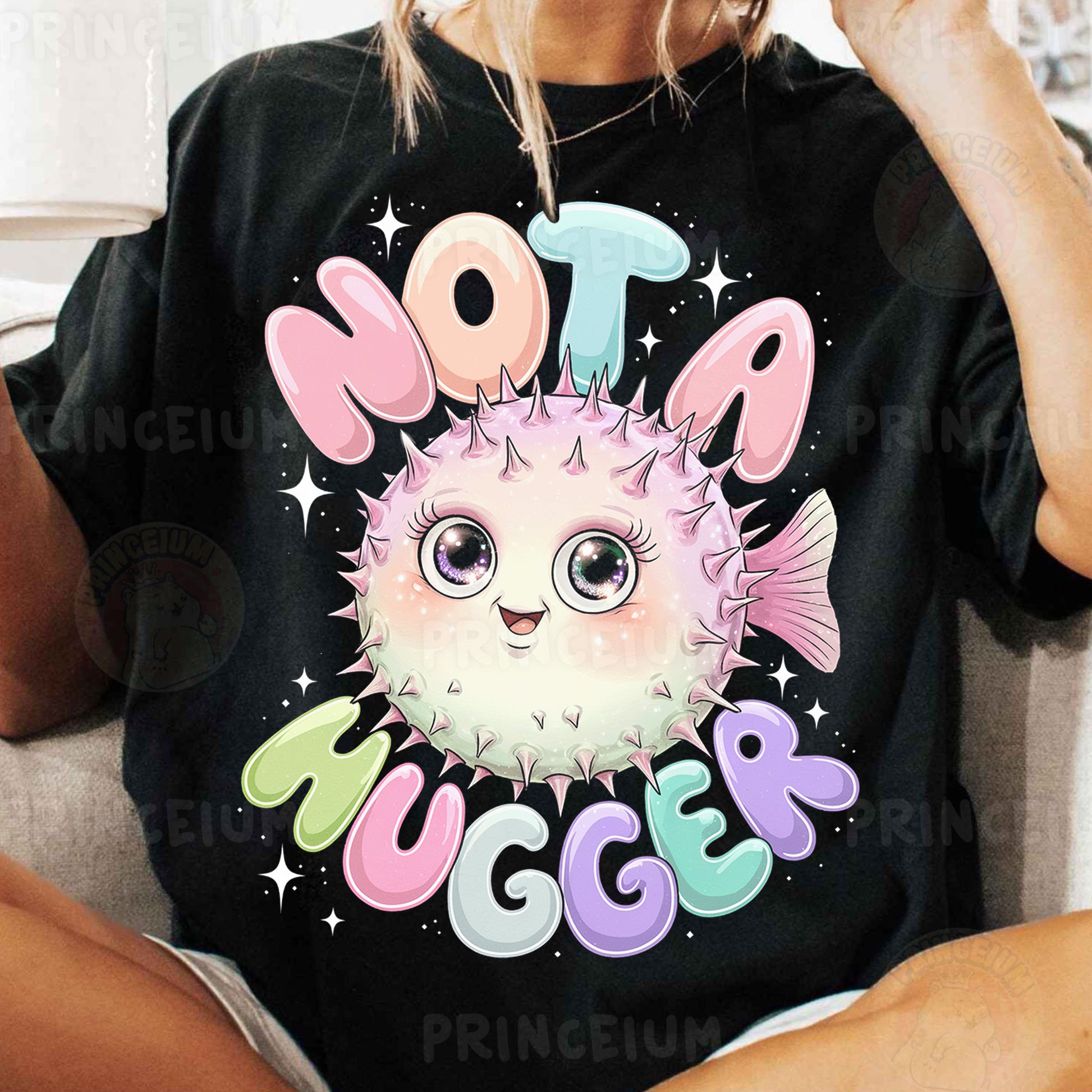 a woman sitting on a couch wearing a t - shirt with a puffer fish