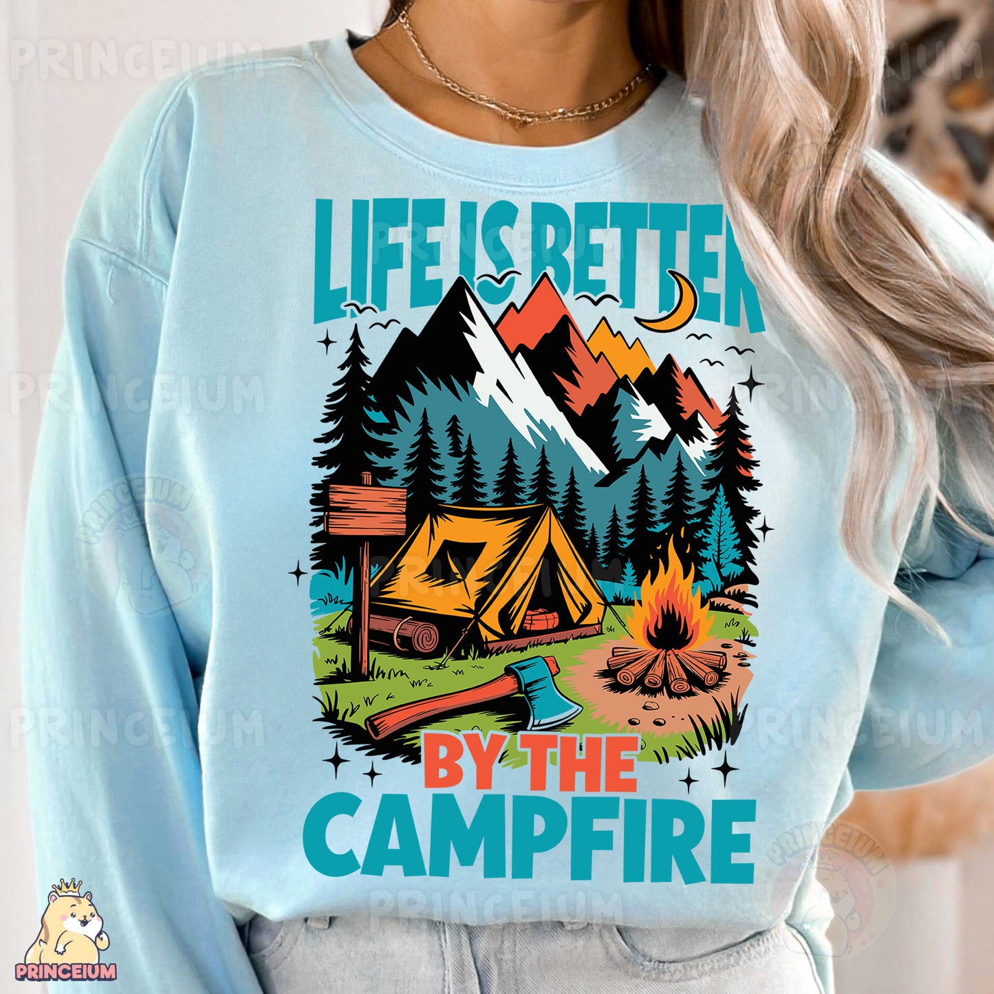 a woman wearing a blue sweatshirt with a campfire graphic