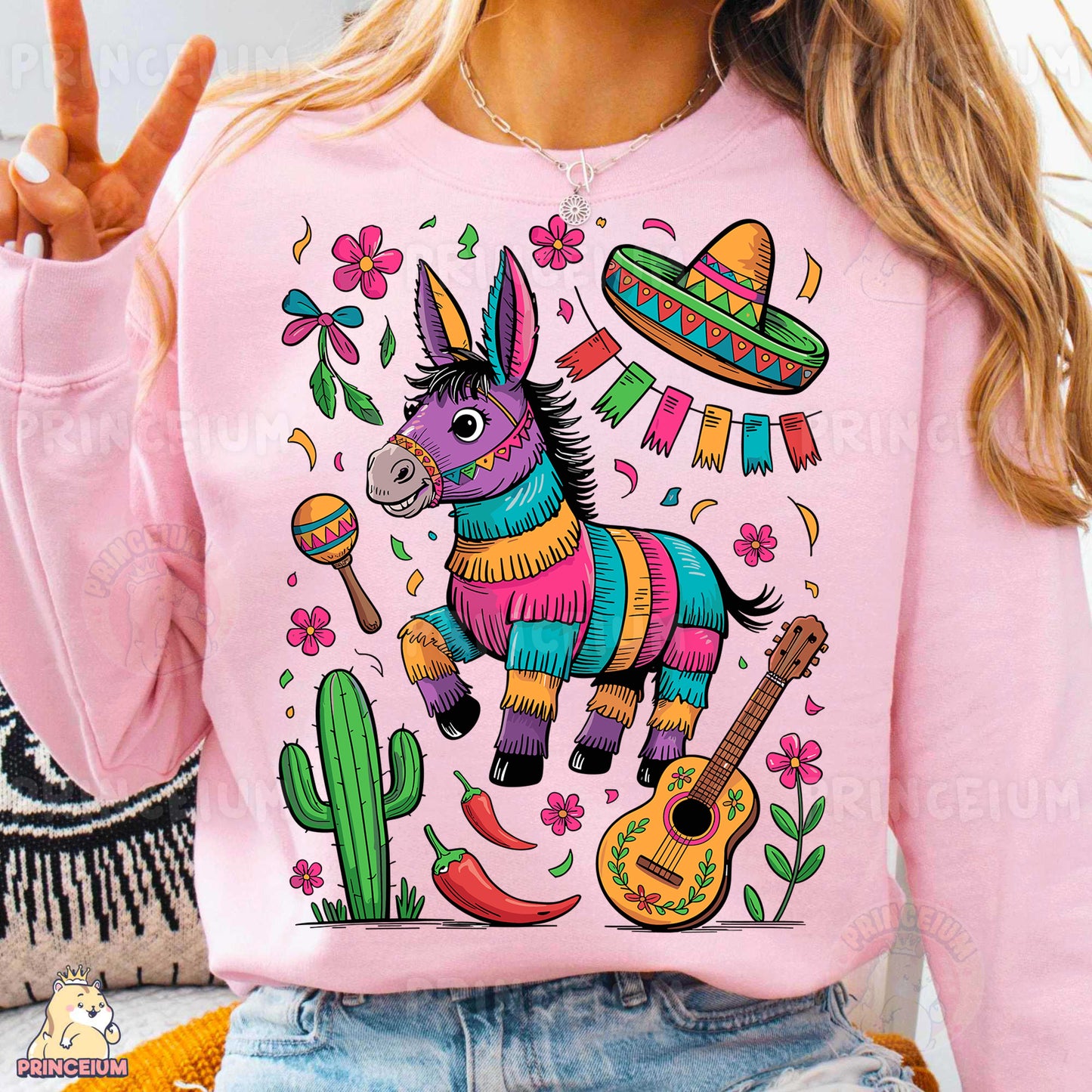 a woman wearing a pink sweater with a mexican donkey on it