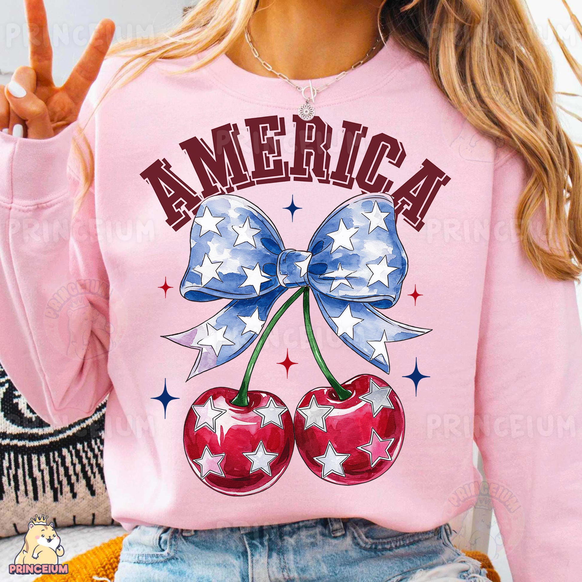 a woman wearing a pink sweatshirt with two cherries on it