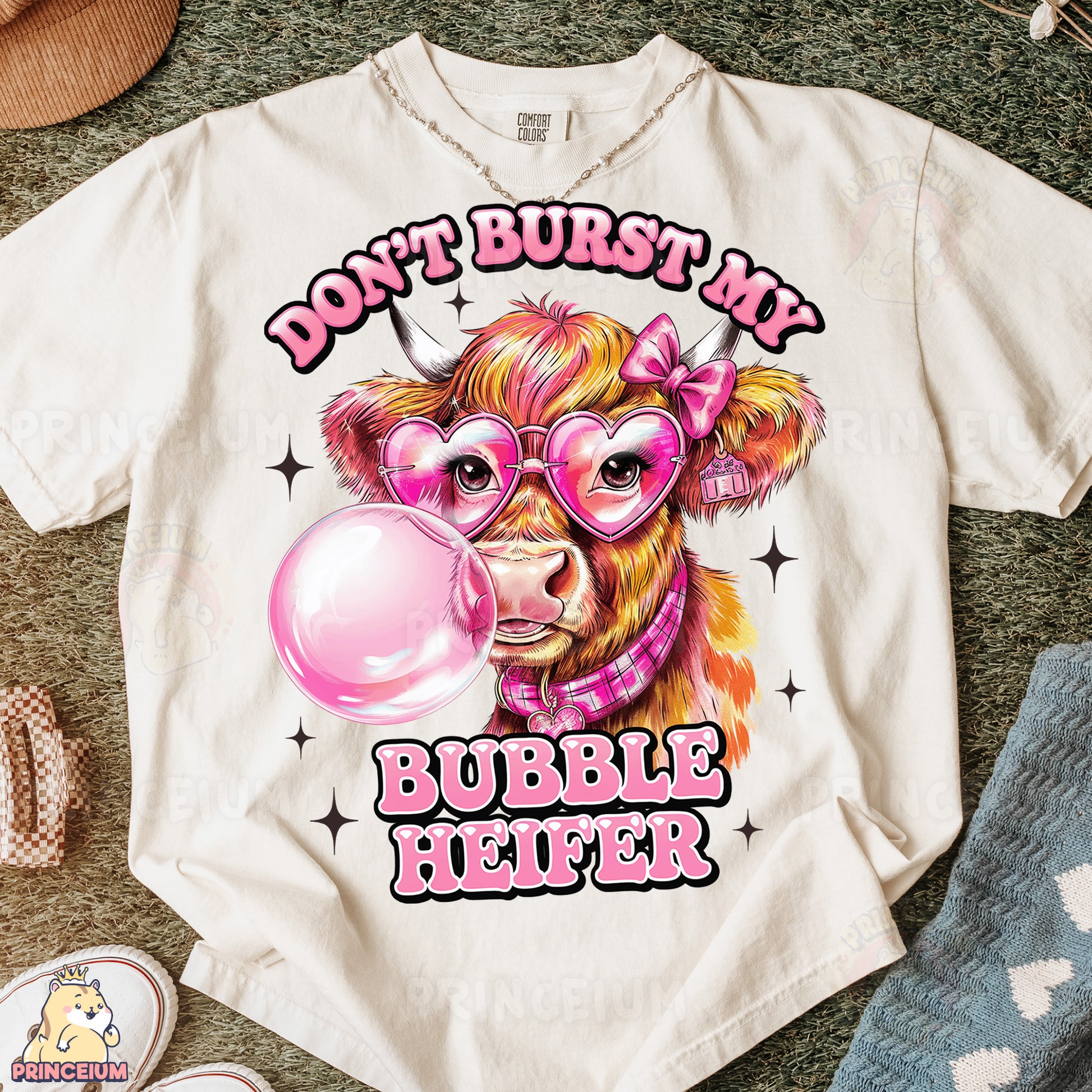 a t - shirt with a picture of a cow wearing glasses