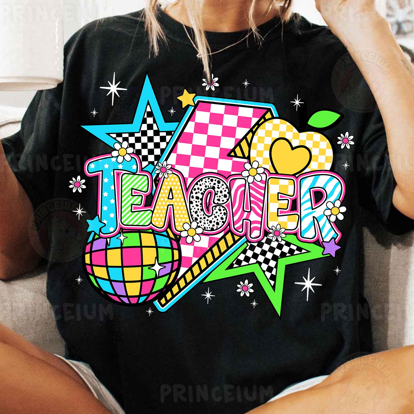 a woman sitting on a couch wearing a black shirt