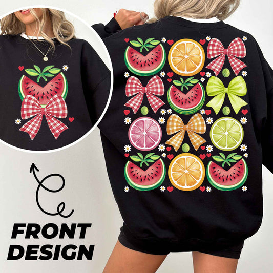 a woman wearing a black sweatshirt with fruit on it