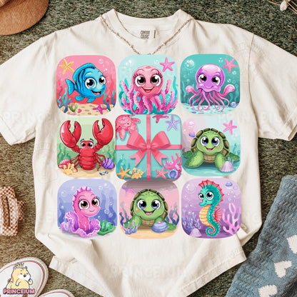 a t - shirt with a picture of a group of sea animals on it