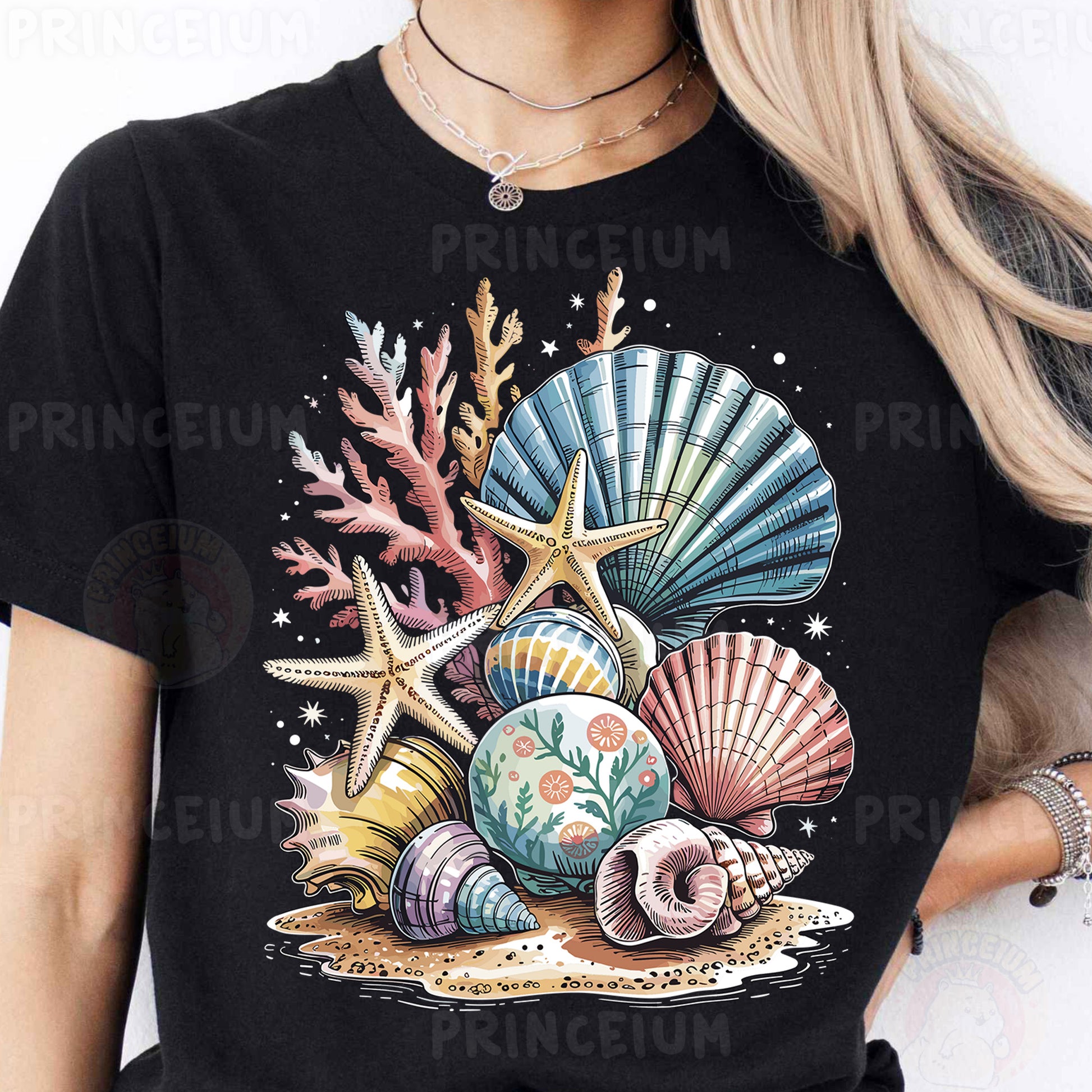 a woman wearing a black t - shirt with seashells on it