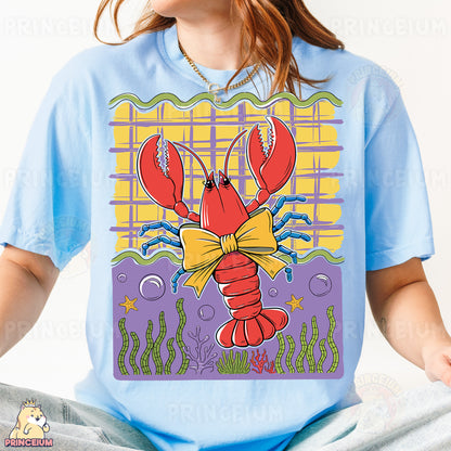 a woman wearing a t - shirt with a lobster on it