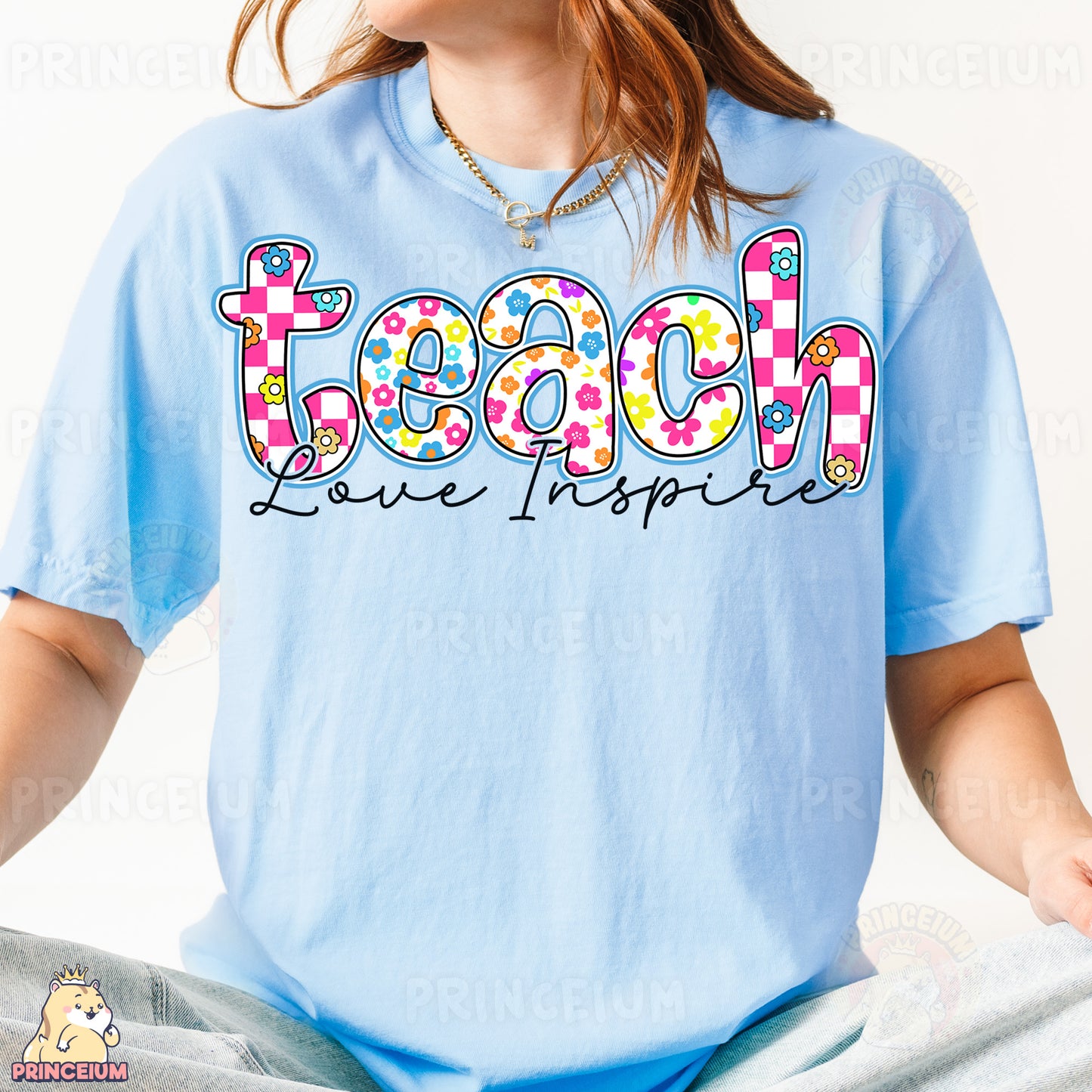 a woman wearing a light blue shirt with the word teach printed on it