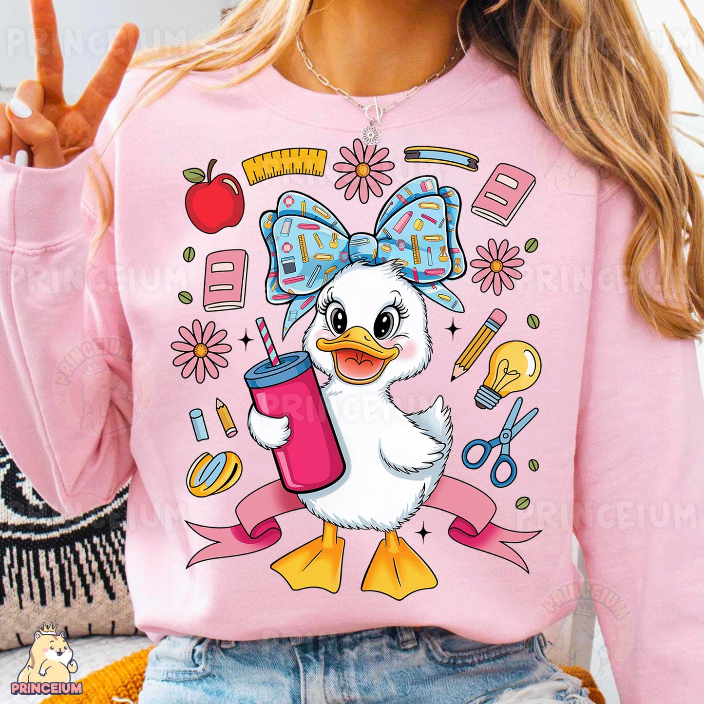 a woman wearing a pink shirt with a duck on it