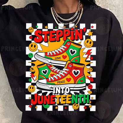 a woman wearing a black sweatshirt with a graphic on it