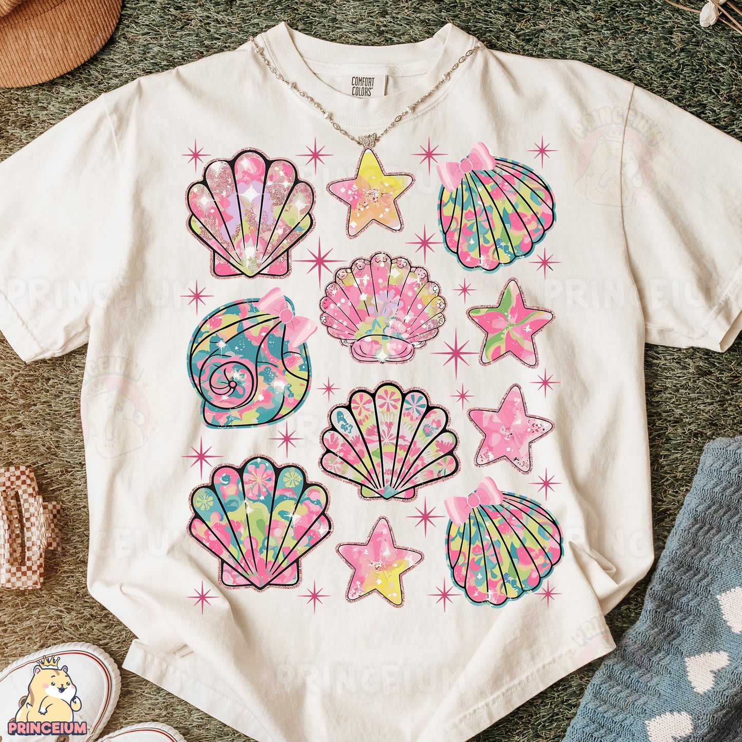 a t - shirt that has a bunch of seashells on it