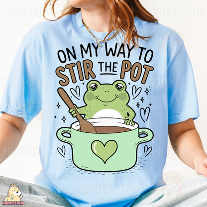 a woman wearing a t - shirt that says on my way to stir the pot
