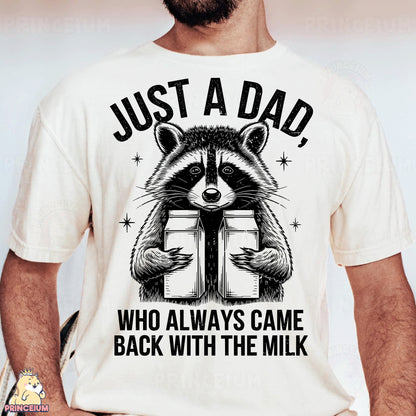 a man wearing a t - shirt with a raccoon reading a book