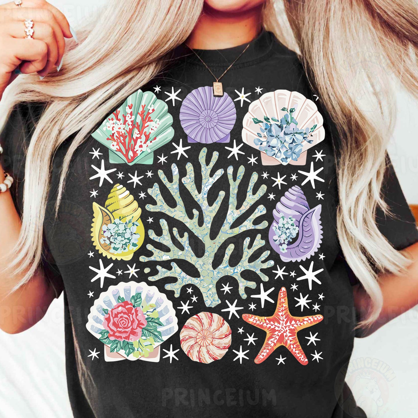 a woman wearing a black shirt with colorful seashells on it