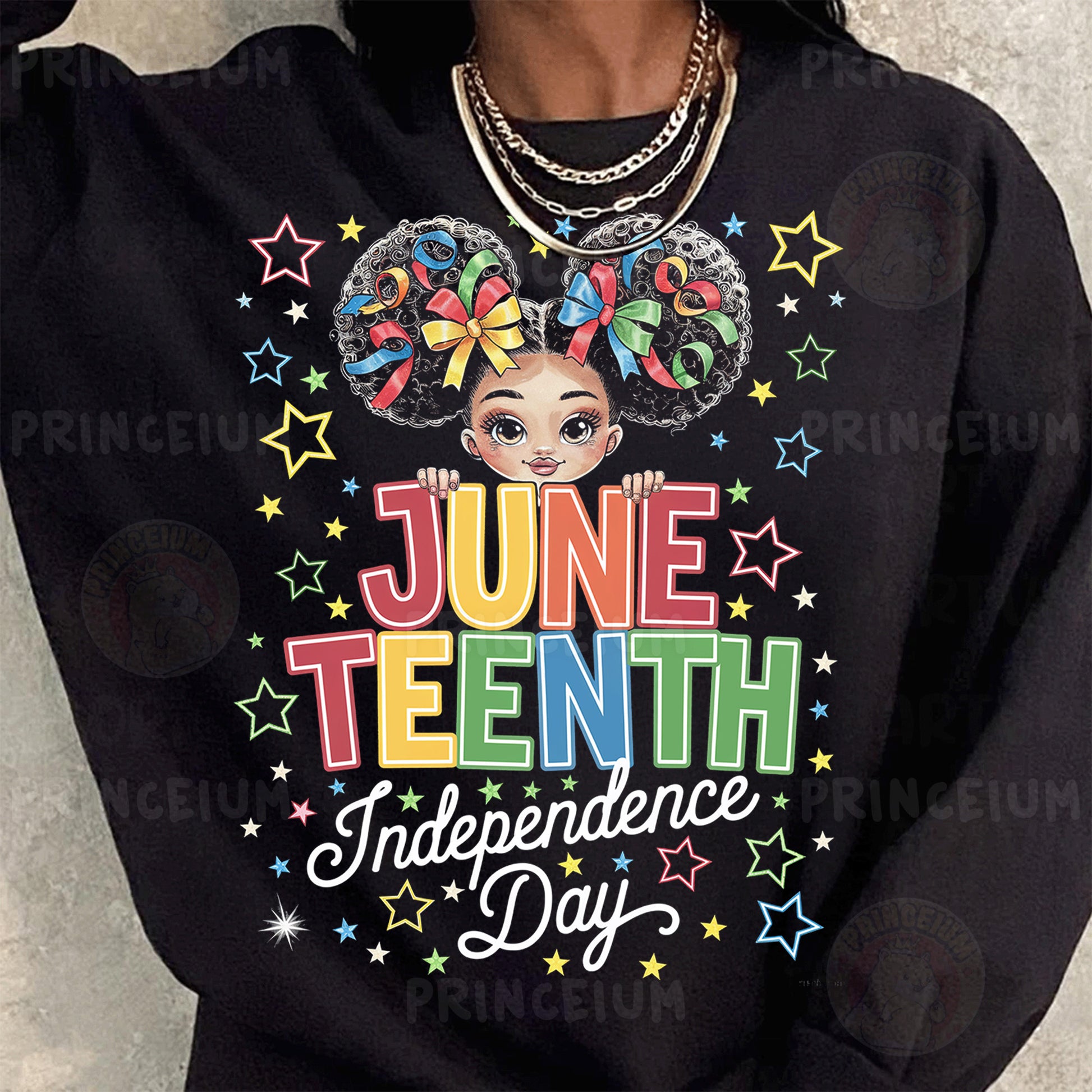 a woman wearing a black sweatshirt with a graphic on it