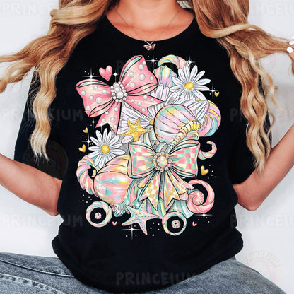 a woman wearing a black t - shirt with a bow and flowers on it