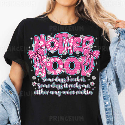 a woman wearing a t - shirt that says motherhood