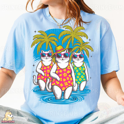 a woman wearing a blue shirt with two cats wearing sunglasses