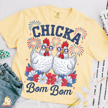 a yellow shirt with two chickens on it