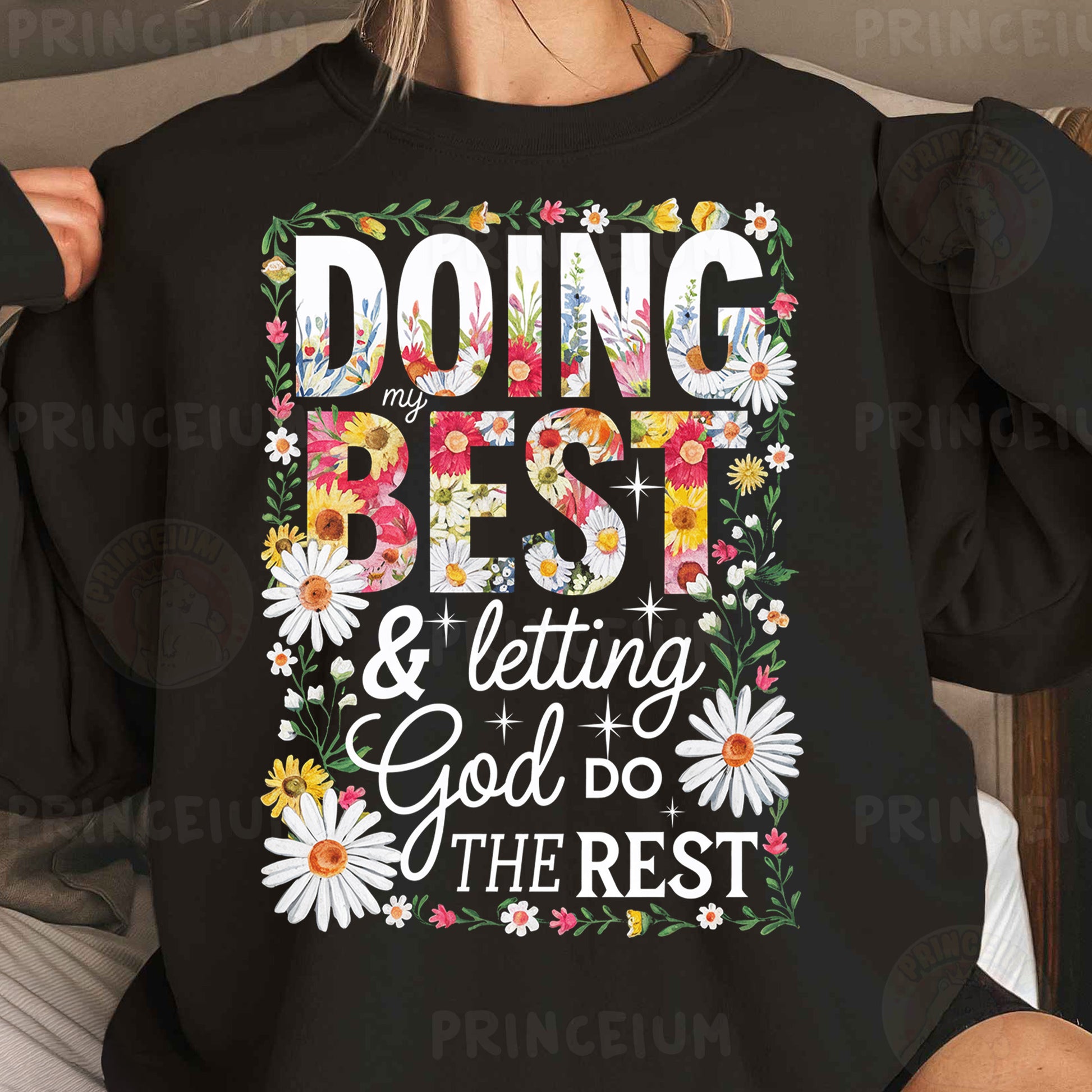 a woman wearing a black sweatshirt that says doing best and letting god do the rest