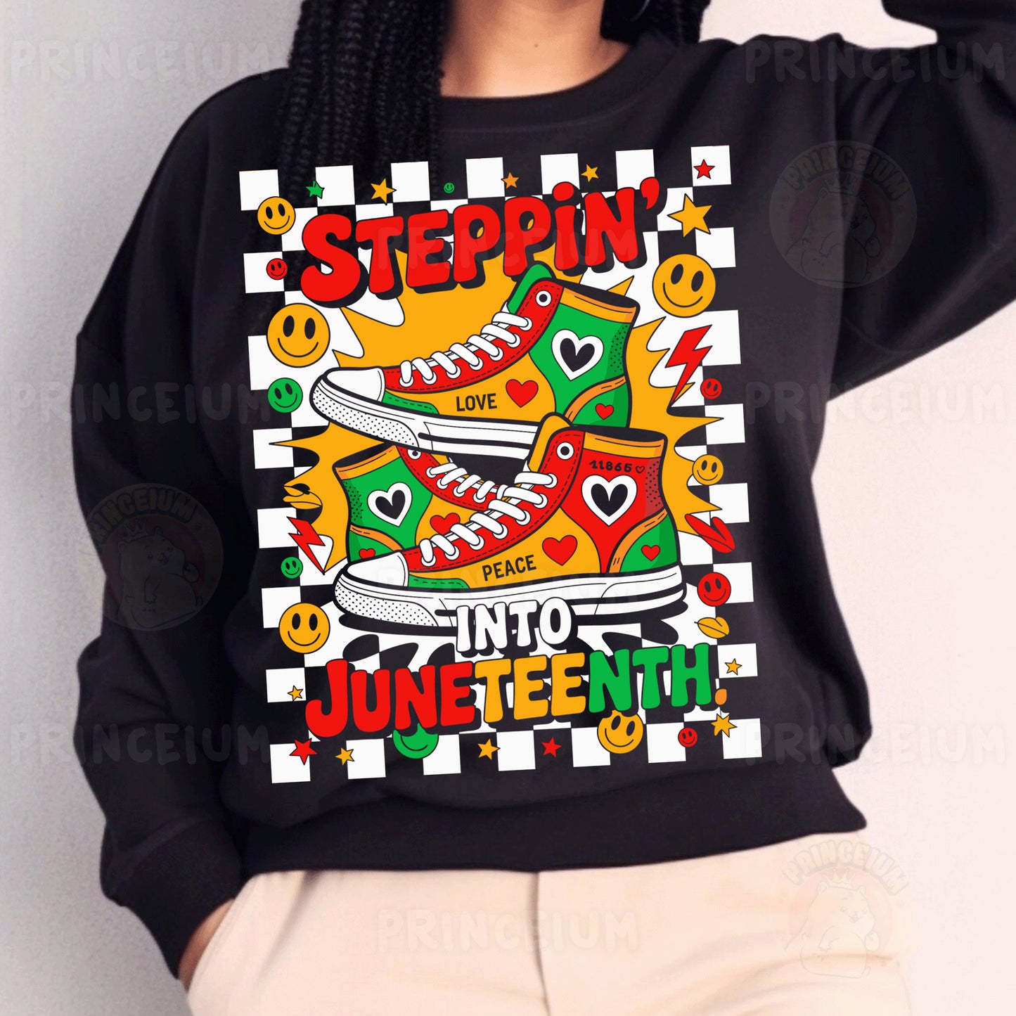 a woman wearing a black sweatshirt with an image of a pair of sneakers on it