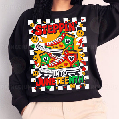 a woman wearing a black sweatshirt with an image of a pair of sneakers on it