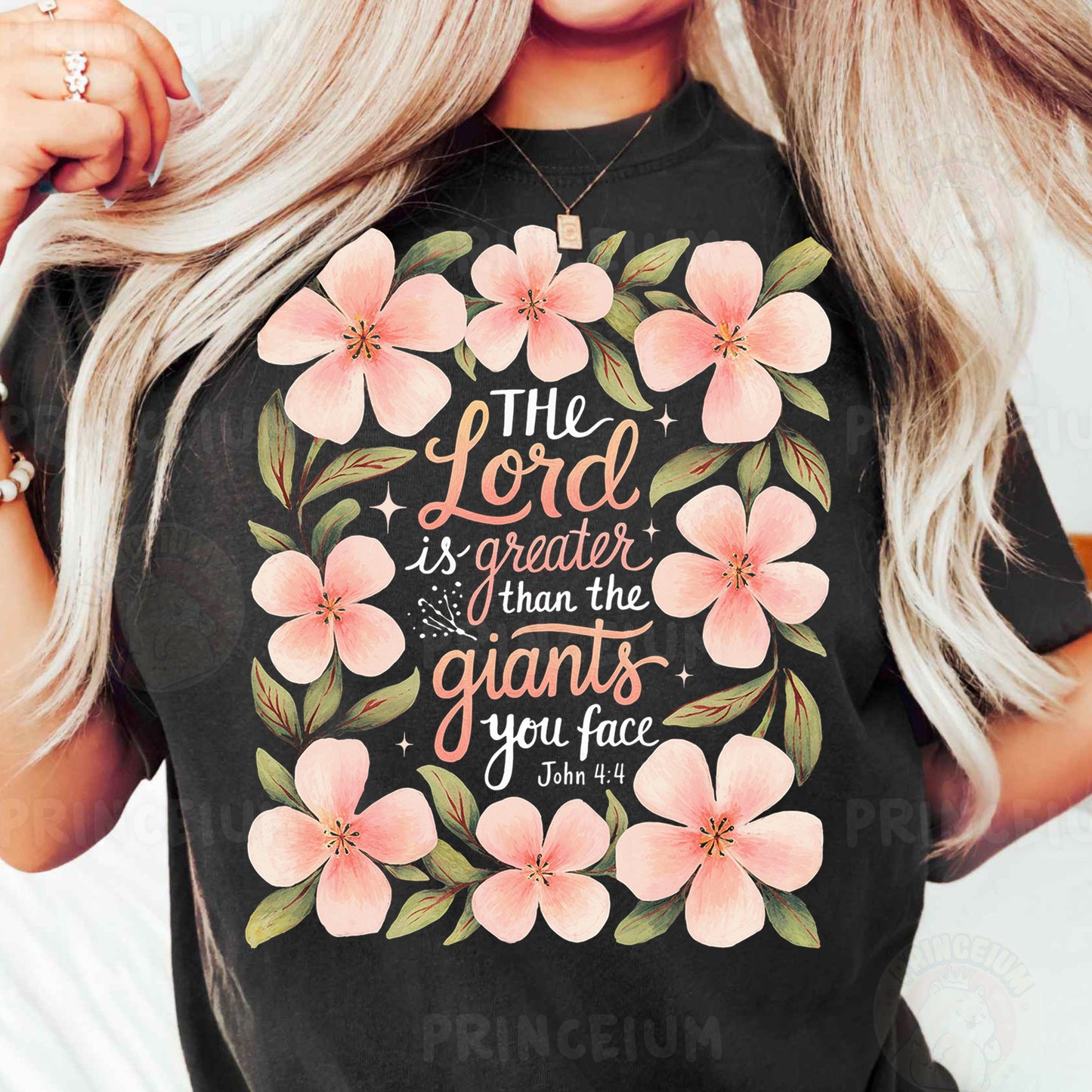 a woman wearing a t - shirt that says the god is greater than the giants