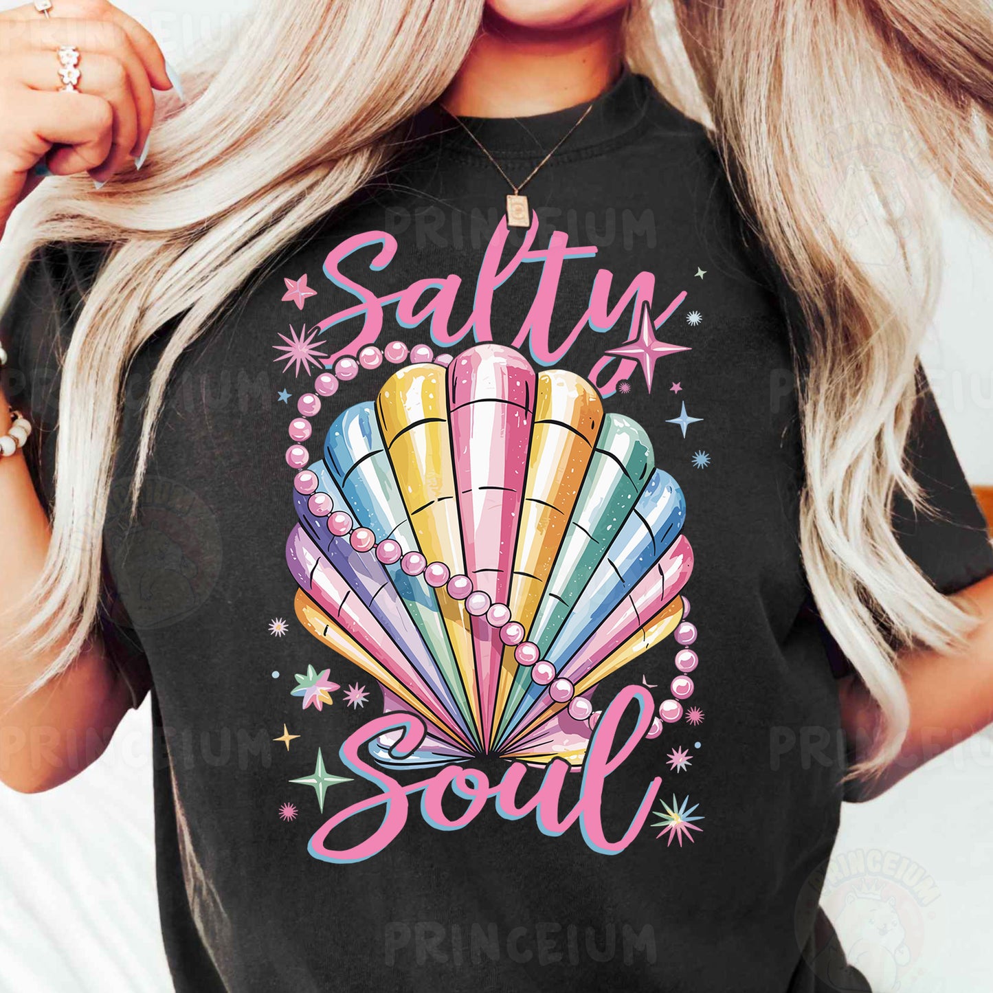 a woman wearing a black tshirt with a colorful seashell on it