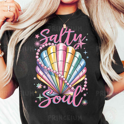 a woman wearing a black tshirt with a colorful seashell on it