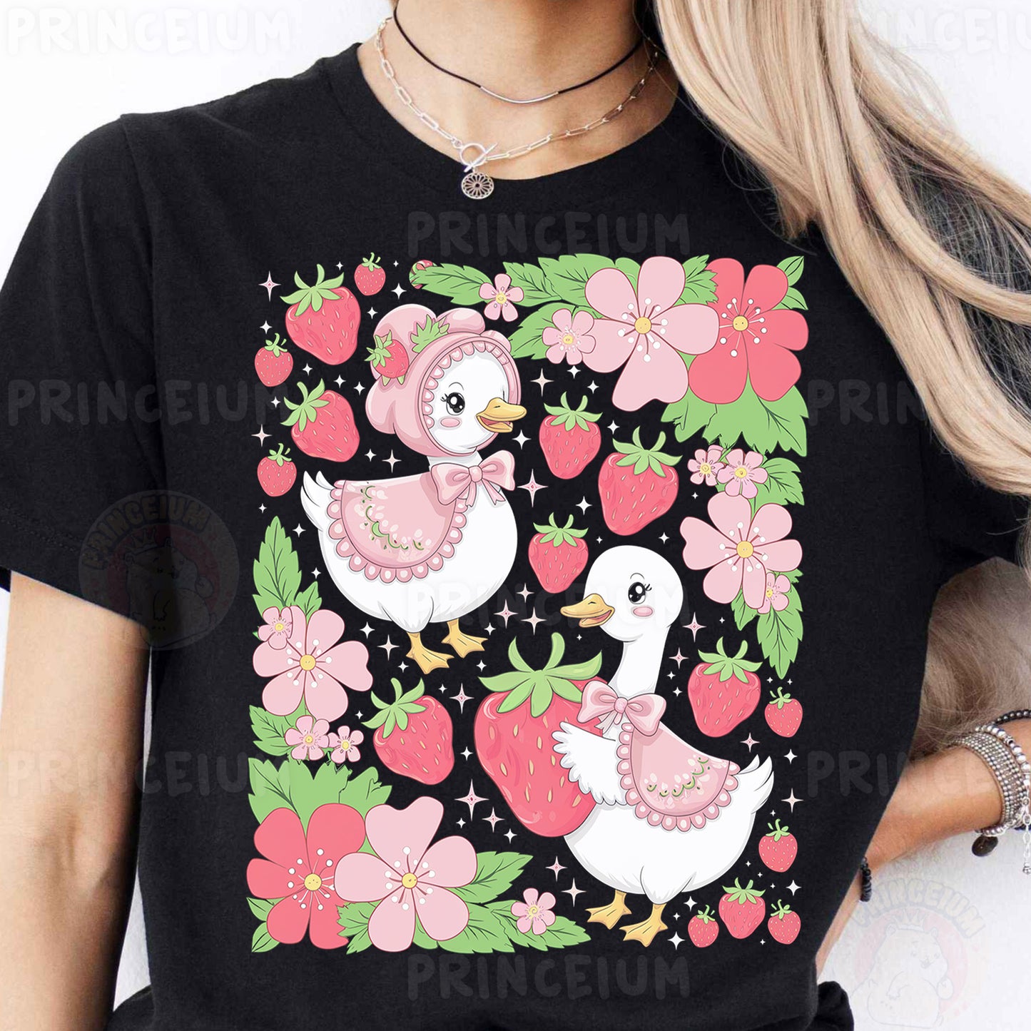 a woman wearing a black t - shirt with pink flowers and birds on it