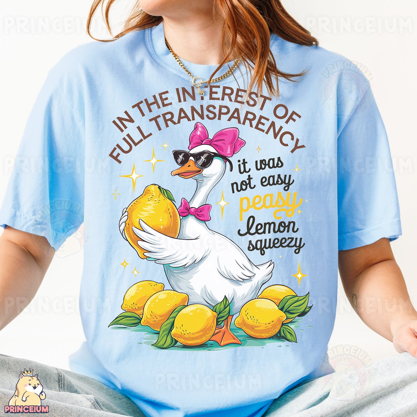 a woman wearing a blue shirt with a duck on it