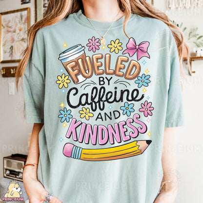 a woman wearing a t - shirt that says fueled by caffeine and kind