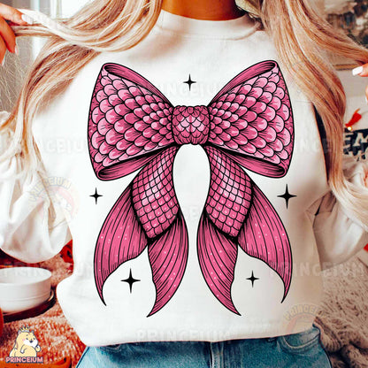 a woman wearing a white shirt with a pink bow on it