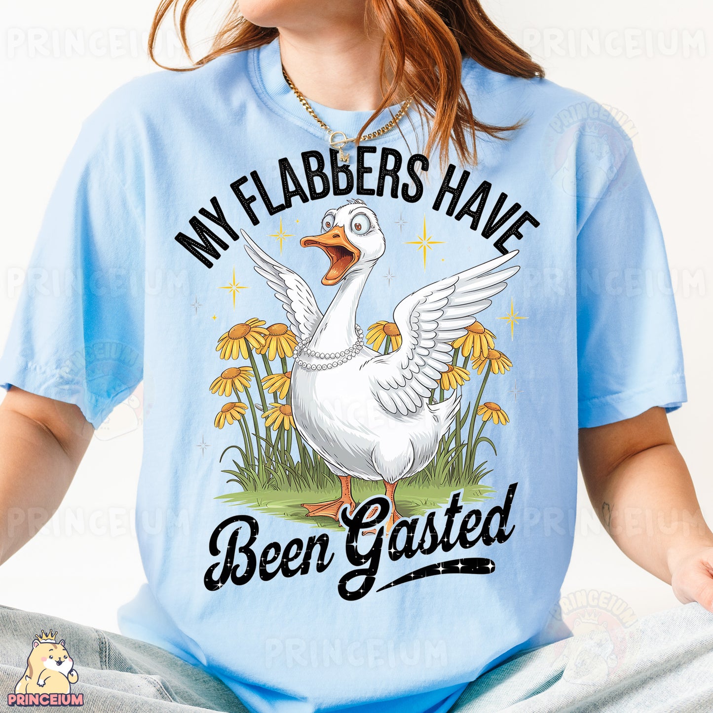 a woman wearing a blue shirt with a white goose on it