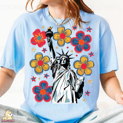 a woman wearing a t - shirt with the statue of liberty on it