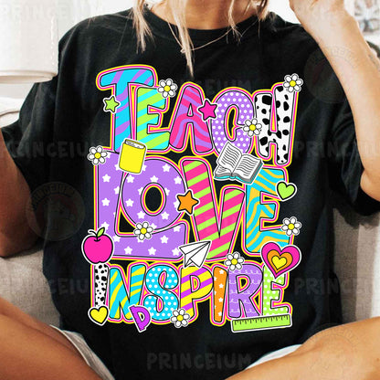 a woman sitting on a couch wearing a t - shirt that says teach love inspire