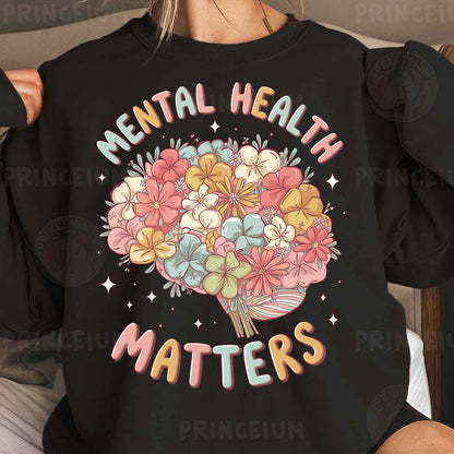 a woman wearing a black sweatshirt that says mental health matters
