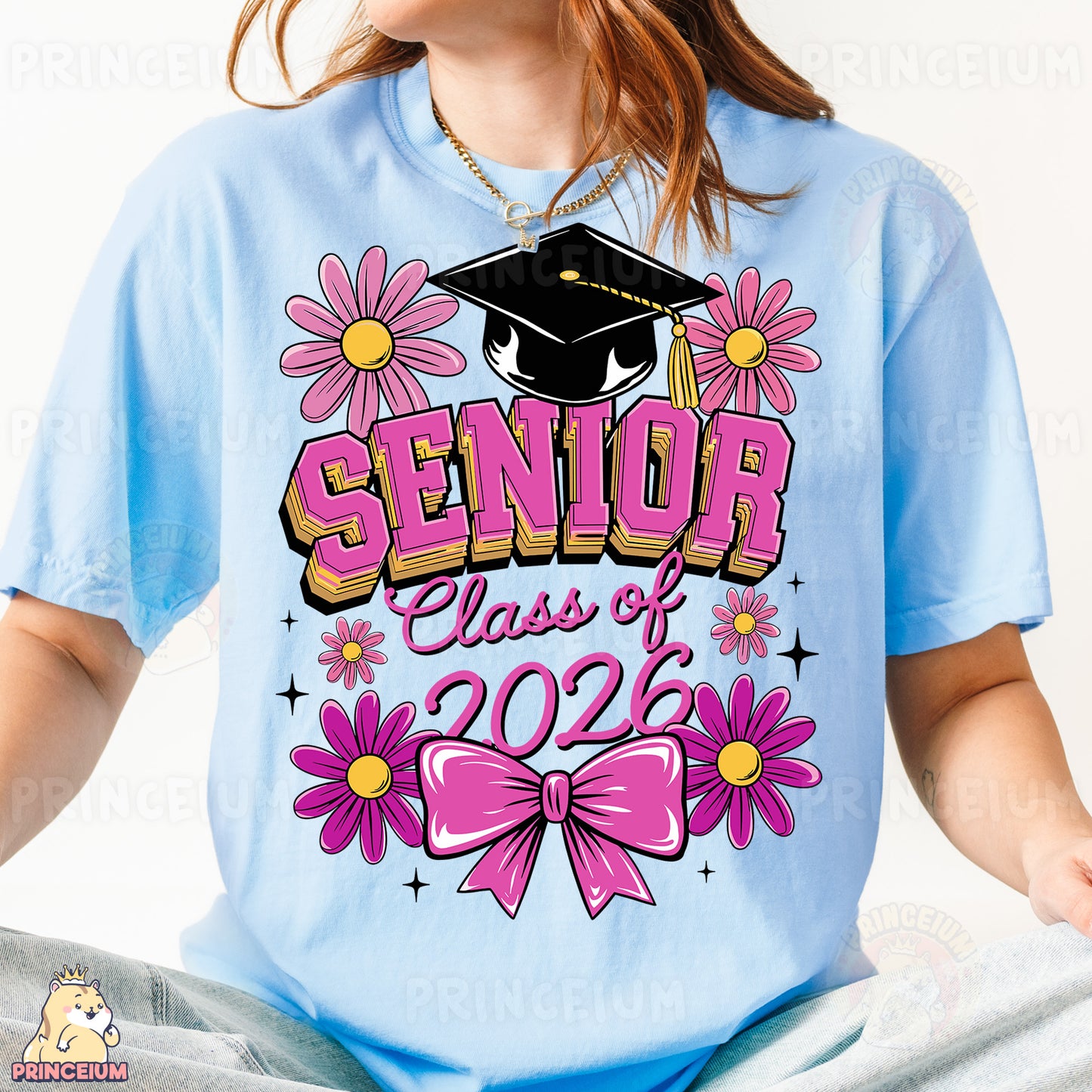 a girl wearing a blue shirt with pink flowers and a graduation cap